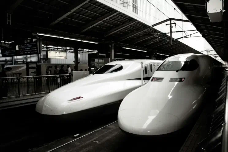 Two bullet trains at a station