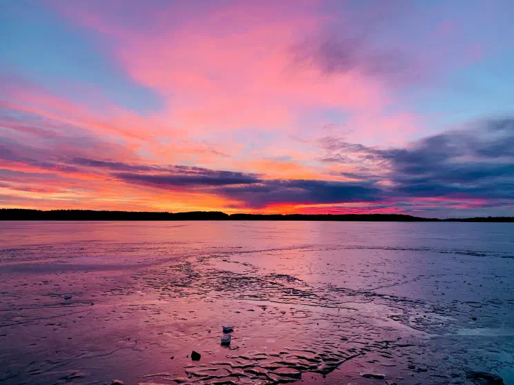 Frozen lake at sunset