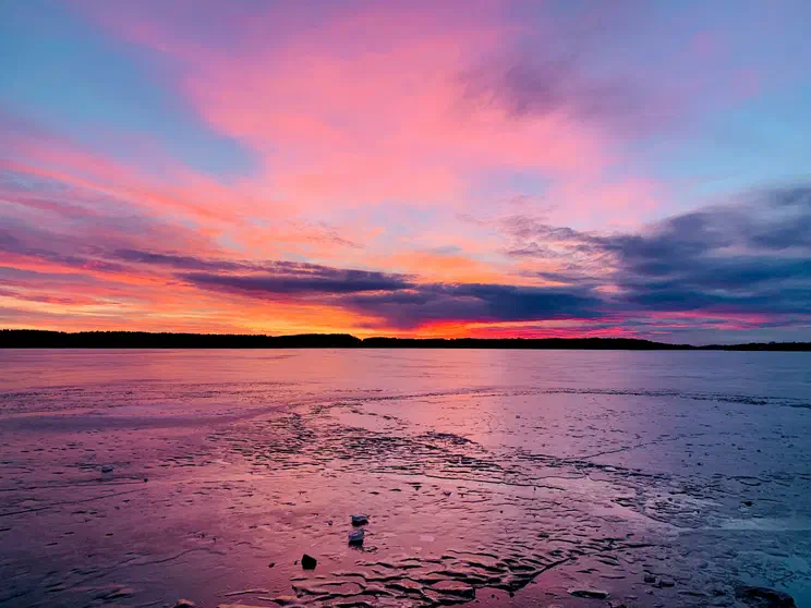 Frozen lake at sunset